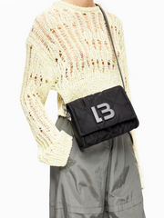 Bimba-Y-Lola-Small-Black-Padded-Nylon-Crossbody-Bag-With-Flap-Balilene-onmodel