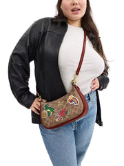 On-Model-Coach-Teri-Shoulder-Bag-In-Signature-Canvas-With-Sticker-Print-Gold-Tan-Multi