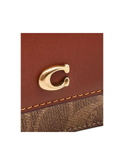 detail-logo-Coach-Half-Flap-Card-Case-In-Colorblock-Signature-Coated-Canvas-Tan-RustWEBP