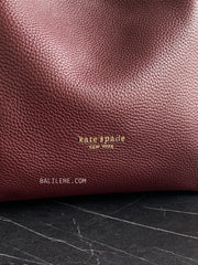 detail-logo-Kate-Spade-Knott-Medium-Crossbody-Tote-Bag-Cordovan-balilene