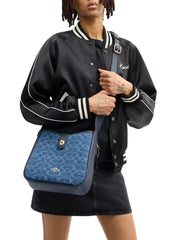 on-model-1-Coach-Hadley-Convertible-Crossbody-Bag-In-Signature-Denim-Indigo