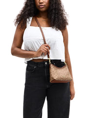 on-model-1-Coach-Laurel-Small-Shoulder-Bag-In-Signature-Canvas-Tan-Brown