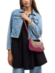 on-model-1-Coach-Teri-Shoulder-Bag-In-Signature-Canvas-With-Bow-Print-Tan-Pink-Multi