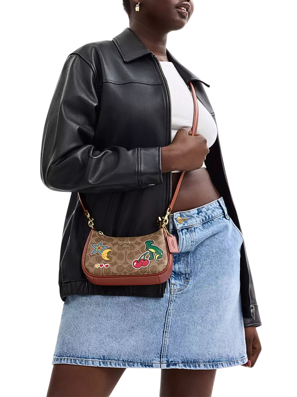 on-model-1-shoulder-Coach-Teri-Mini-Crossbody-Bag-In-Signature-Canvas-With-Sticker-Print-Tan-Multi