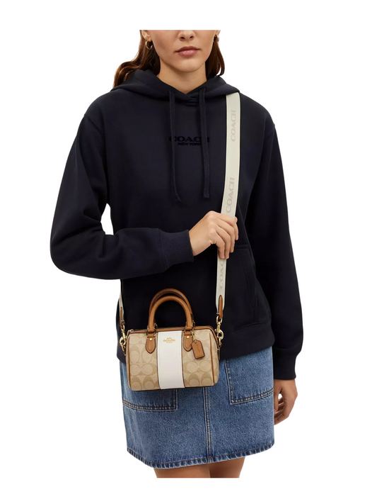 on-model-2-Coach-Mini-Rowan-Crossbody-In-Signature-Canvas-With-Stripe-Light-Khaki-Chalk-Saddle