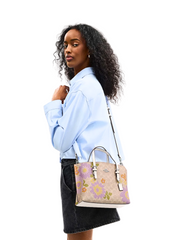 on-model-2-Coach-Mollie-Tote-Bag-25-In-Signature-Canvas-With-Floral-Print-Sand-Multi