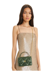 on-model-2-Tory-Burch-Mini_Kira_Diamond_Quilt_Top_Handle_Chain_Wallet