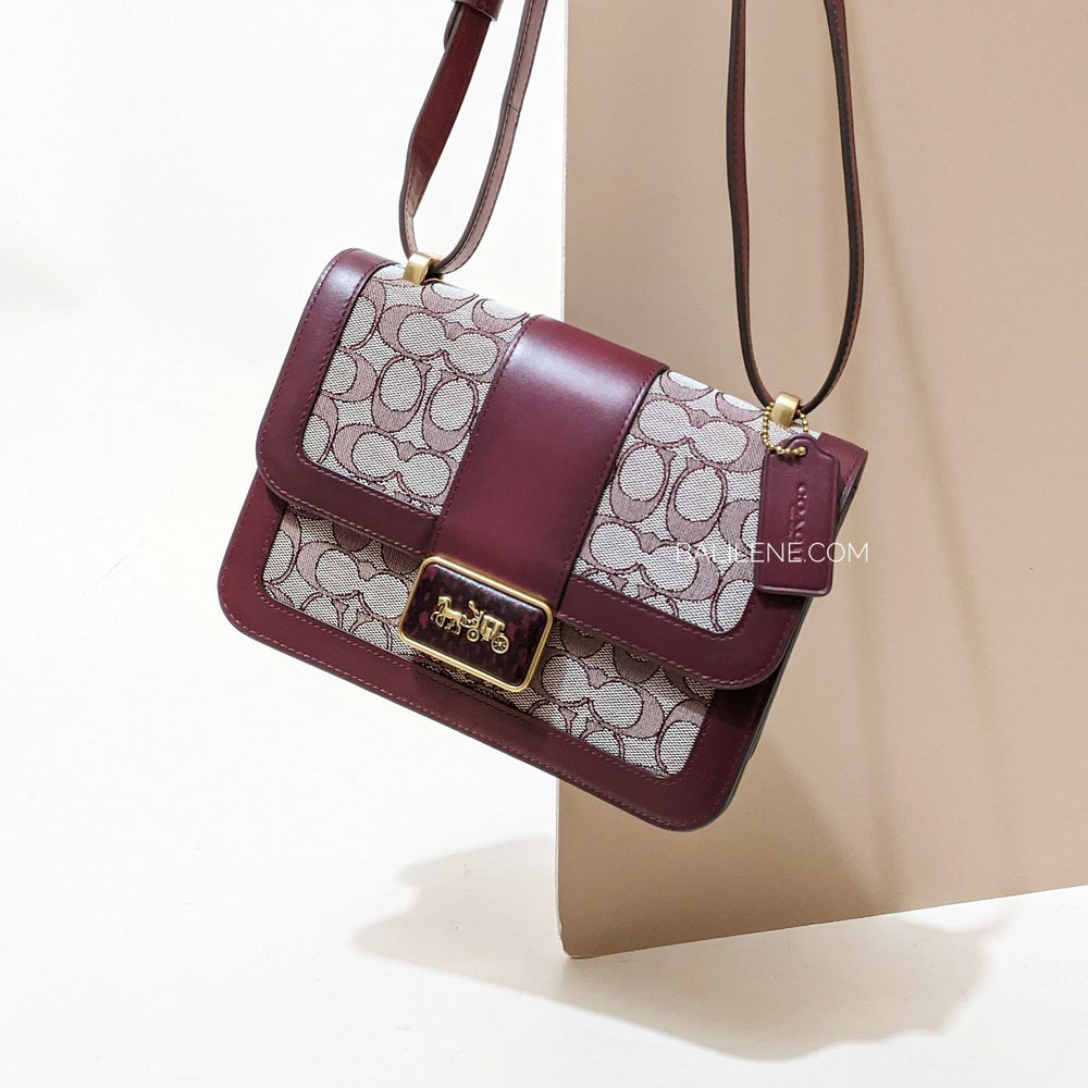 on-model-Coach-Alie- Shoulder- Bag- in-Signature-Jacquard-With- Snakeskin -Detail -Burgundy/Black/Cherry