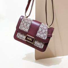 on-model-Coach-Alie- Shoulder- Bag- in-Signature-Jacquard-With- Snakeskin -Detail -Burgundy/Black/Cherry