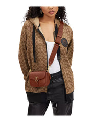 on-model-Coach-Amelia-Small-Saddle-Bag-in-Pebble-Leather-Redwood