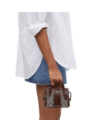 on-model-Coach-Andrea-Mini-Carryall-In-Signature-Jacquard-Oak-Maple