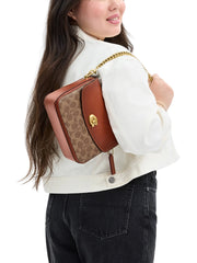 on-model-Coach-Cassie-Crossbody-Bag-19-In-Signature-Canvas-Tan-Caramel