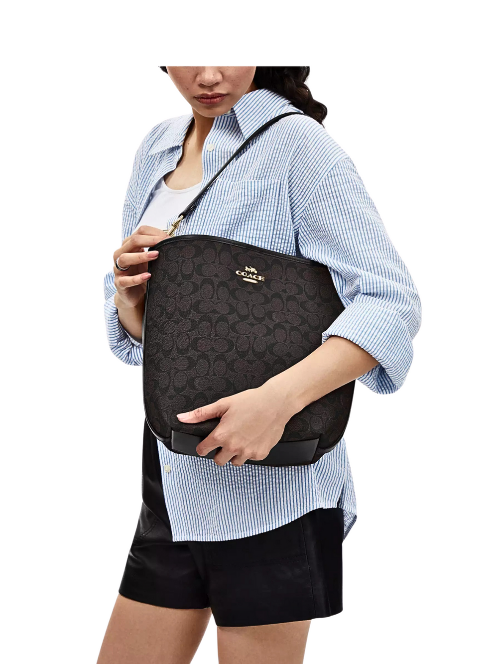 on-model-Coach-City-Large-Bucket-Bag-In-Signature-Canvas-Walnut-Black