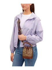 on-model-Coach-Dempsey-Drawstring-Bucket-Bag-15-In-Signature-Canvas-With-Snowflake-and-stars-Print-Khaki-MultiWEBP