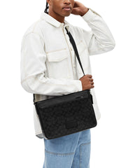 on-model-Coach-District-Crossbody-Bag-In-Signature-Canvas-Charcoal-Black
