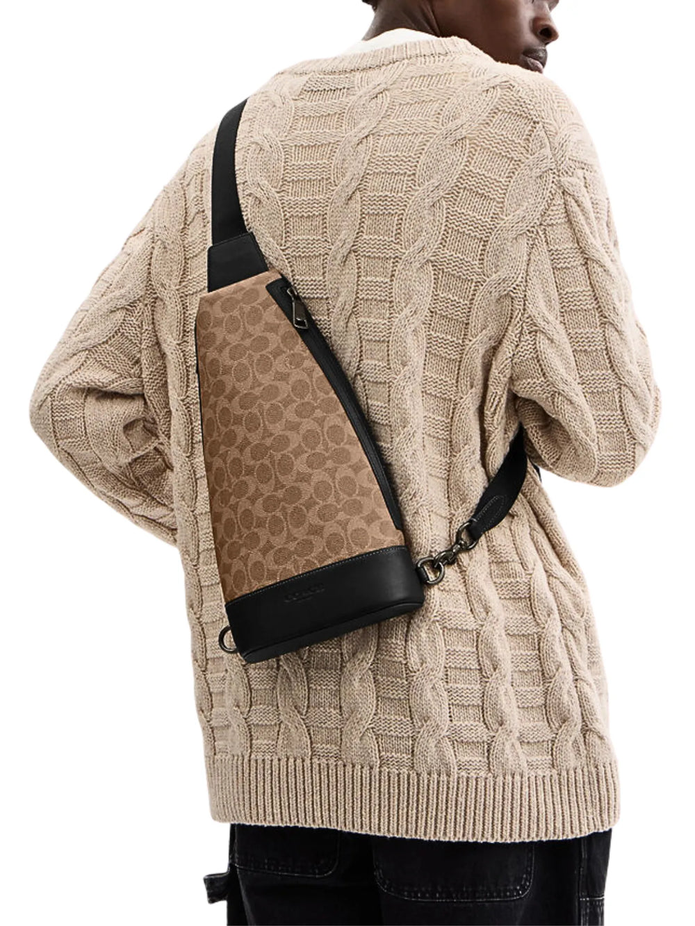 on-model-Coach-Dominic-Sling-Pack-In-Signature-Canvas-Tan-Black