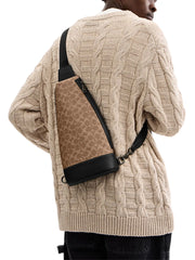 on-model-Coach-Dominic-Sling-Pack-In-Signature-Canvas-Tan-Black
