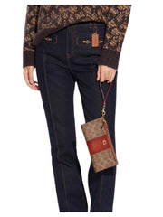 on-model-Coach-Double-Zip-Wallet-Signature-Canvas-Tan-Rust