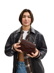 on-model-Coach-Eliza-Mini-Top-Handle-Bag-Maple