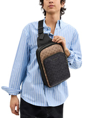 on-model-Coach-Ethan-Pack-In-Blocked-In-Signature-Canvas-Tan-Charcoal-Black