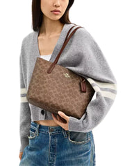 on-model-Coach-Fiona-Zip-Tote-Bag-In-Signature-Canvas-Tan-Brown