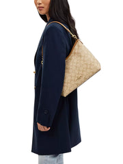 on-model-Coach-Laurel-Shoulder-Bag-In-Signature-Canvas-Light-Khaki-Light-Saddle