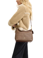 on-model-Coach-Laurel-Shoulder-Bag-In-Signature-Canvas-Tan-Brown