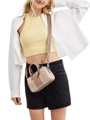 on-model-Coach-Mini-Rowan-Crossbody-In-Signature-Canvas-With-Stripe-Sand-Taupe