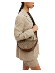 on-model-Coach-Pace-Shoulder-Bag-In-Signature-Canvas-KhakiSaddle