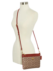 on-model-Coach-Polly-Crossbody-Bag-In-Signature-Canvas-Tan-Rust