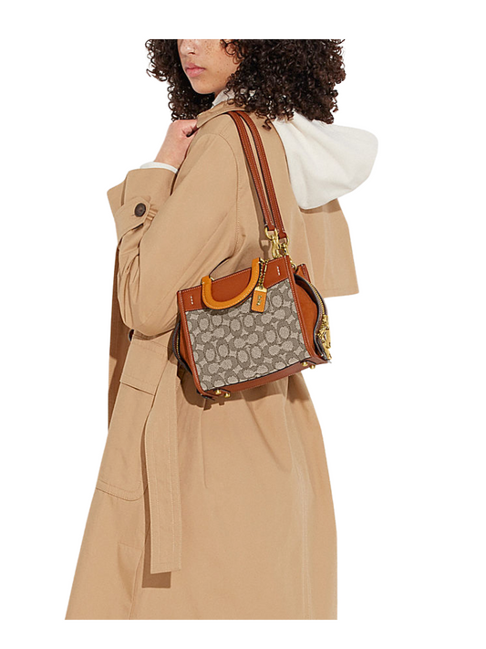 on-model-Coach-Rogue-20-In-Signature-Textile-Jacquard-Cocoa-Burnished-Amber