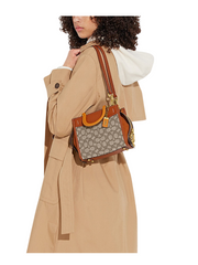 on-model-Coach-Rogue-20-In-Signature-Textile-Jacquard-Cocoa-Burnished-Amber