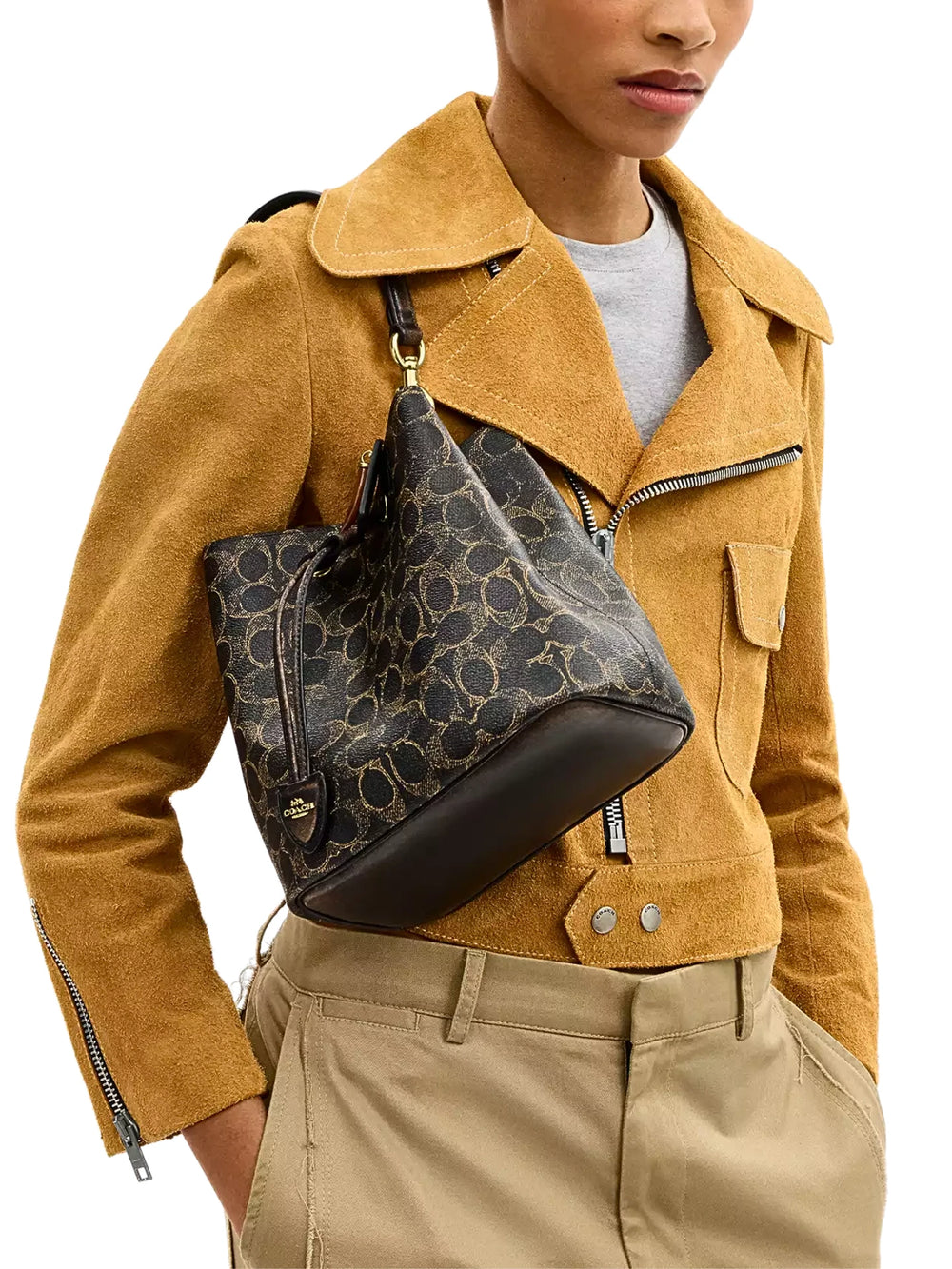 on-model-Coach-Rowan-Bucket-Bag-In-Loved-Signature-Canvas-With-Charms-Brown
