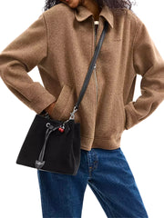 on-model-Coach-Rowan-Bucket-Bag-With-Cherry-Charm-Black