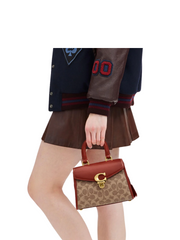 on-model-Coach-Sammy-Top-Handle-21-In-Signature-Canvas-Tan-Rust