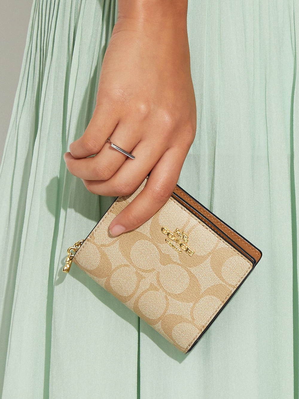 on-model-Coach-Snap-Wallet-In-Signature-Canvas-Khaki-Saddle