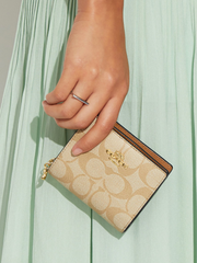 on-model-Coach-Snap-Wallet-In-Signature-Canvas-Khaki-Saddle