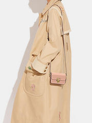 on-model-Coach-Studio-12-In-Patent-Leather-Latte