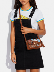 on-model-Coach-Studio-Shoulder-Bag-19-With-Patches-Saddle
