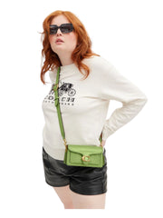 on-model-Coach-Tabby-20-Shoulder-Bag-in-Signature-Patent-Leather-Green