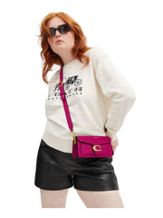 on-model-Coach-Tabby-20-Shoulder-Bag-in-Signature-Patent-Leather-Magenta