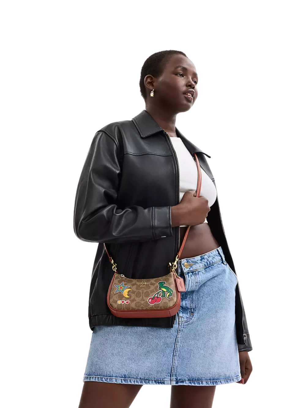 on-model-Coach-Teri_Mini-Crossbody-Bag-In-Signature-Canvas-With-Sticker-Print-Tan-Multi