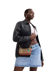 on-model-Coach-Teri_Mini-Crossbody-Bag-In-Signature-Canvas-With-Sticker-Print-Tan-Multi