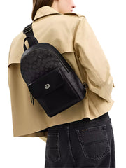 on-model-Coach-Turnlock-Sling-Pack-In-Signature-Canvas-Charcoal-Black