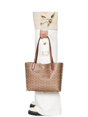 on-model-Coach-Willow-Tote-In-Signature-Canvas-Tan-Caramel