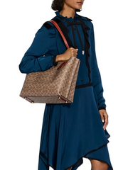 on-model-Coach-Willow-Tote-In-Signature-Canvas-Tan-Rust