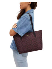 on-model-Coach-Zip-Top-Tote-Signature-Canvas-Oxblood-Multi
