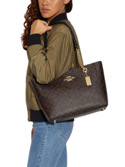 on-model-Coach- Cammie -Chain -Tote- In- Signature -Canvas -Gold-/-Brown -Black