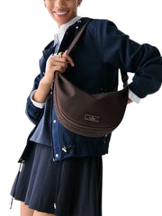 on-model-Kate-Spade-Carter-Nylon-Medium-Sling-Bag-Hot-Fudge