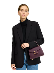 on-model-Kate-Spade-Katy-Small-Top-handle-Bag-Deep-Cherry-Deep-Cherry